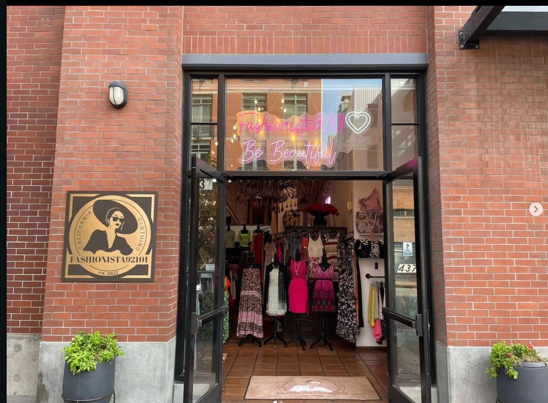 Fashionista 92101 boutique storefront with colorful clothing displayed inside